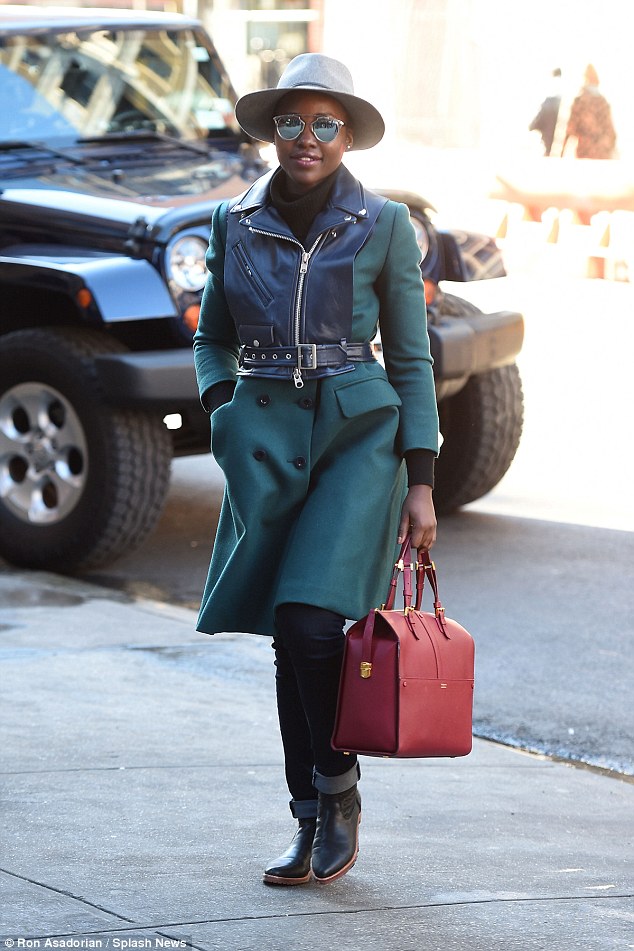 LUPITA NYONG’O FLAWLESS IN A GREEN COAT AND HAT