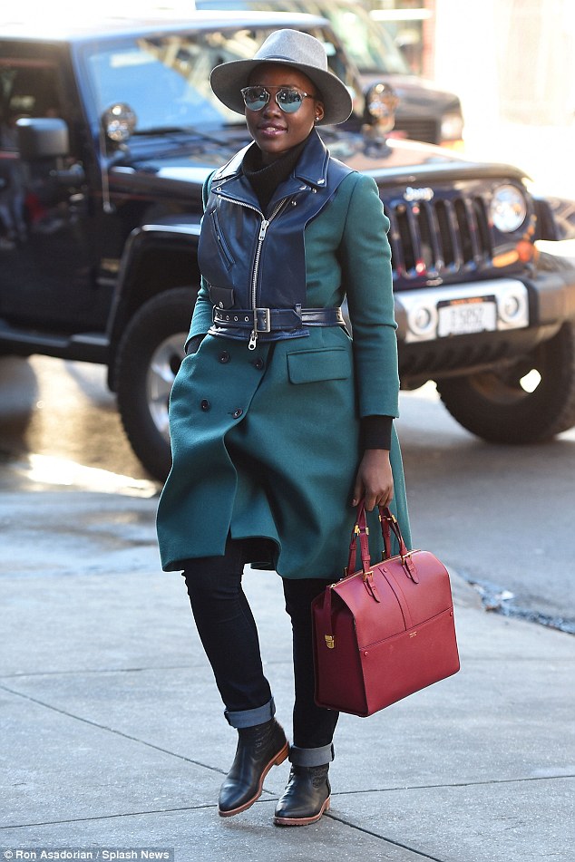 LUPITA NYONG’O FLAWLESS IN A GREEN COAT AND HAT